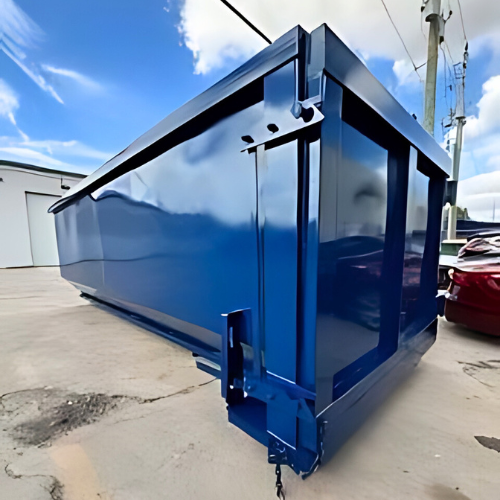 A 30-yard roll-off dumpster at a commercial demolition site, built for handling large volumes of waste.